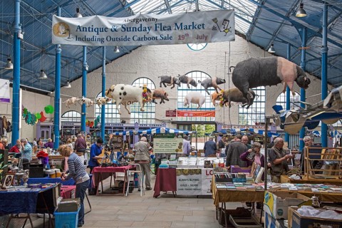 Flea market inside Market Hall building, Abergavenny, Monmouthshire, South Wales, UK