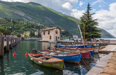 Rowing boats in the harbour, old customs house Casa del Dazio, Torbole, Lake Garda, Trentino,