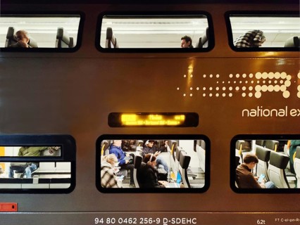National Express RE6 double-decker commuter train in the evening, Duesseldorf Central Station,