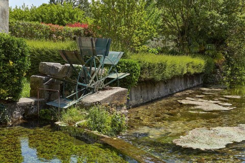 Old mill wheel of a watermill in Goudargues, Departement Gard, Occitanie region, France, Europe