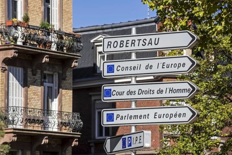 Signpost with directions to the several European Union office buildings in the European quarter at
