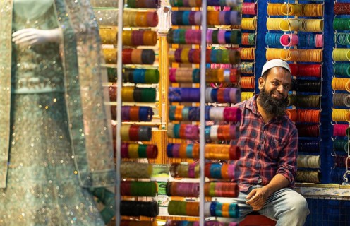 Trader with Hyderabad's famous glass hoops, bazaar, at Charminar, Hyderabad, Andhra Pradesh, India,