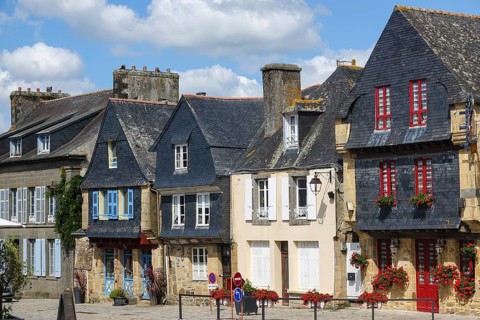 Rue du General de Gaulle in the old town centre of Le Faou with slate-roofed granite houses from