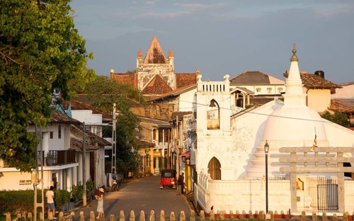 Street and house in historic town of Galle, Sri Lanka, Asia with Christian church and Buddhist
