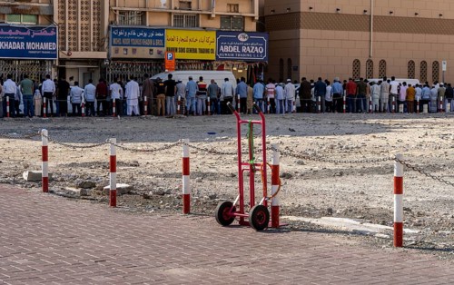 Midday prayer in front of a mosque, Al Fahidi neighbourhood, Dubai, United Arab Emirates, Asia