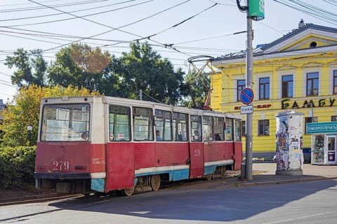 Red Russian tram KTM-5M3 71-605, Soviet streetcar in the city centre of Tomsk, Tomsk Oblast,