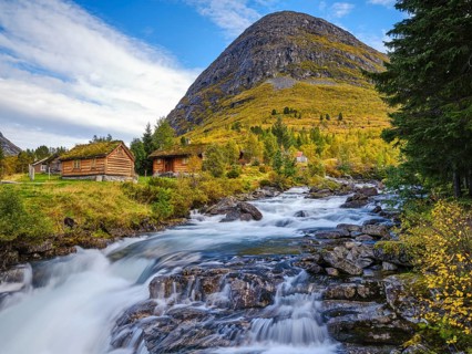Autumn in Valldalen, cabins by a river in front of a mountain, Reinheimen National Park, More og