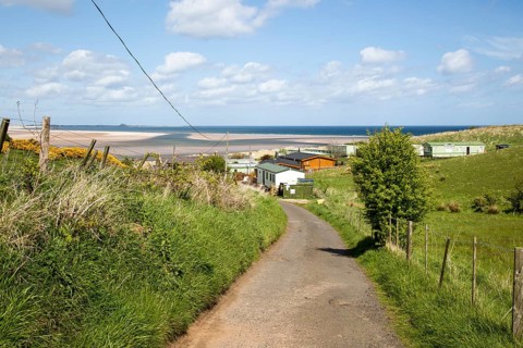 Tourist accommodation at Budle Bay, Northumberland coast, England, UK
