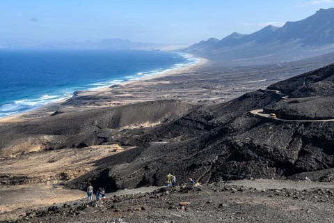 View from viewpoint Mirador di Cofete on surf in front of beach of East Atlantic Atlantic landscape