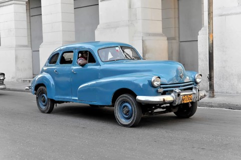 Blue vintage car from the 50s in Avenida Simon Bolivar, Calle Reina, centre of Havana, Centro