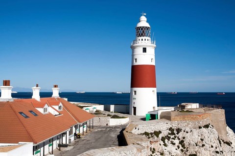 Red and white striped lighthouse at Europa Point, Gibraltar, British terroritory in southern Spain,