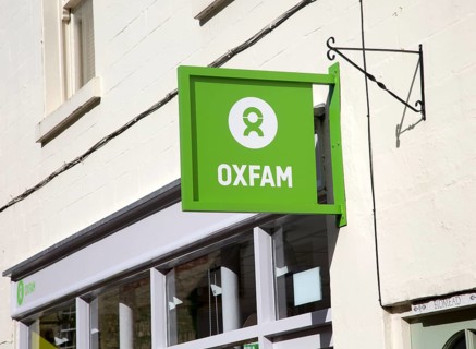 Oxfam charity shop sign, Corsham, Wiltshire, England, Uk