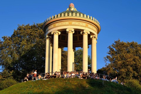 People enjoying the autumn sun at the Monopteros in the English Garden, Munich, Bavaria, Germany,