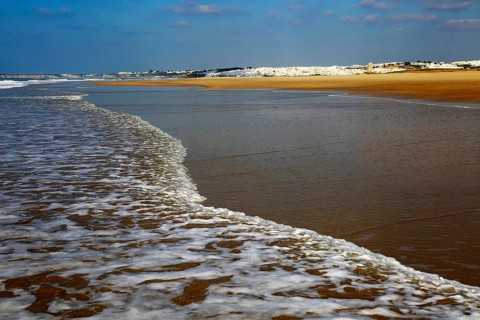 Wave breaking on sandy beach at Conil de la Frontera, Cadiz Province, Spain, Europe