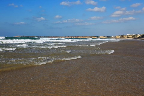 Waves breaking on sandy beach at Conil de la Frontera, Cadiz Province, Spain, Europe