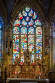 High altar and stained glass windows in the choir of Saint Germain church, Enclos Paroissial de