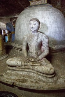 Buddha figure inside Dambulla cave Buddhist temple complex, Sri Lanka, Asia