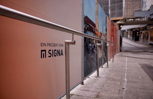 Construction site, controversial building project of Rene Benko's insolvent company Signa, logo,
