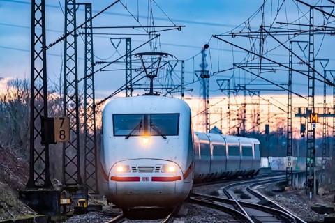 Railway line with many overhead lines and railway signals, InterCityExpress ICE of Deutsche Bahn