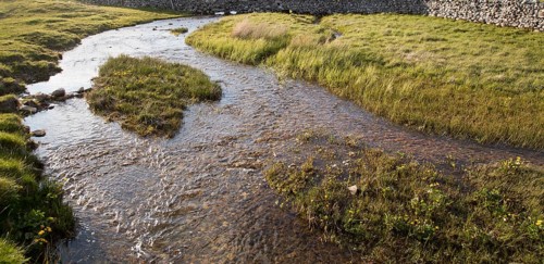 Stream flowing over limestone rock, Malham, Yorkshire Dales national park, England, UK