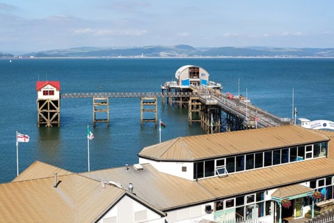 Pier and lifeboat station, Mumbles, Gower peninsula, near Swansea, South Wales, UK
