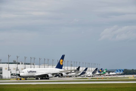 Lufthansa Airbus A380-800 in tow with push back truck in front of Terminal 2, Munich Airport, Upper