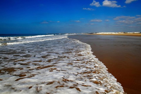 Wave breaking on sandy beach at Conil de la Frontera, Cadiz Province, Spain, Europe