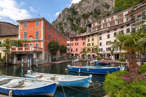 Houses and fishing boats in the old harbour of Limone sul Garda, Lake Garda, Province of Brescia,