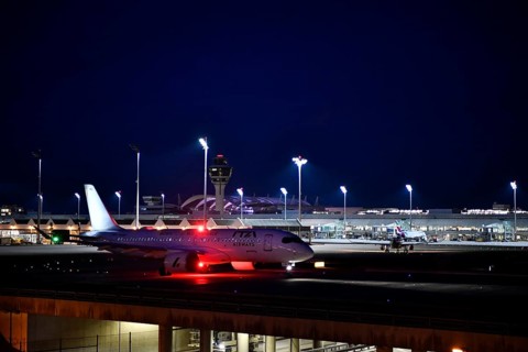 ITA Airways Airbus A220-300 taxiing on taxiway at night, Munich Airport, Upper Bavaria, Bavaria,