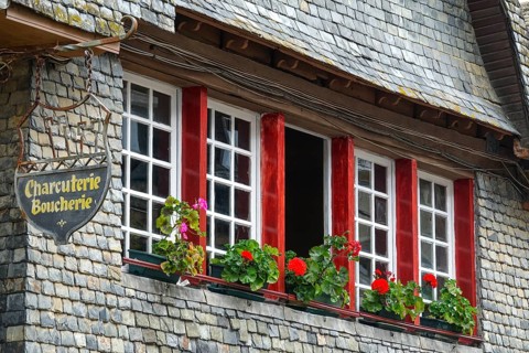 Rue du General de Gaulle in the old town centre of Le Faou with slate-roofed granite houses from