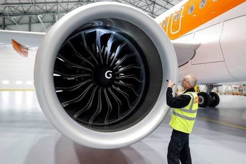 Olaf Gross, Licence Engineer at easyJet, checks the engine of an Airbus A320 Neo in front of the