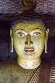 Buddha figure inside Dambulla cave Buddhist temple complex, Sri Lanka, Asia