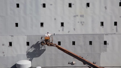 RFA Mounts Bay ship in dry dock being painted, Falmouth, Cornwall, England, UK