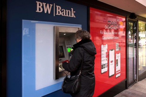 Elderly woman, best ager, inserts EC card, credit card, PIN, purse, ATM of BW-Bank