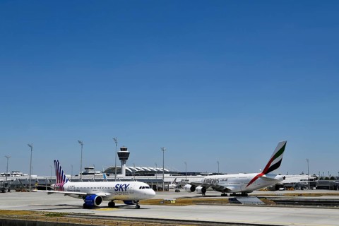 Sky Express Airbus A320 Neo and Emirates Airways Airbus A380-800 taxiing on apron in front of