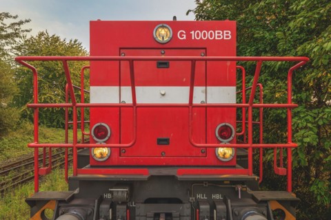 Front view of a red locomotive with headlights and metal grille, Lower Rhine, North