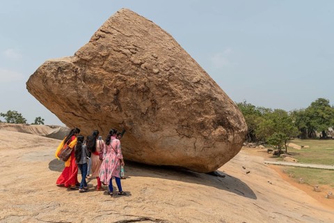 Indian tourists, Krishna's butterball, natural boulder, UNESCO World Heritage Site, Mahabalipuram