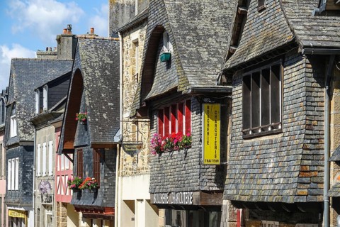 Rue du General de Gaulle in the old town centre of Le Faou with slate-roofed granite houses from