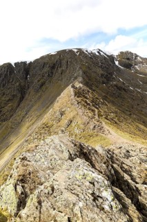 Striding Edge arete and Helvellyn mountain peak, Lake District, Cumbria, England, UK