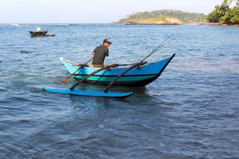 Fishing using traditional outrigger canoes, Mirissa, Sri Lanka, Asia