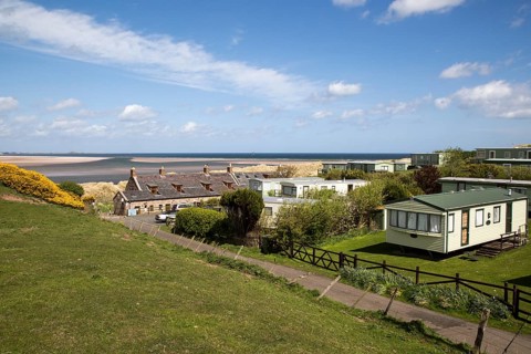 Tourist accommodation at Budle Bay, Northumberland coast, England, UK
