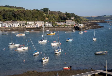 Yachts at moorings on River Fal, Flushing, Cornwall, England, UK
