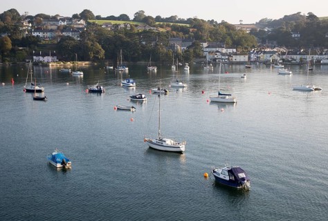 Yachts at moorings on River Fal, Flushing, Cornwall, England, UK