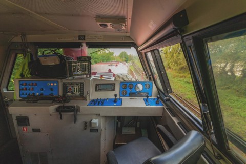 Interior view of an engine driver's cab with controls and view through the window, Lower Rhine,