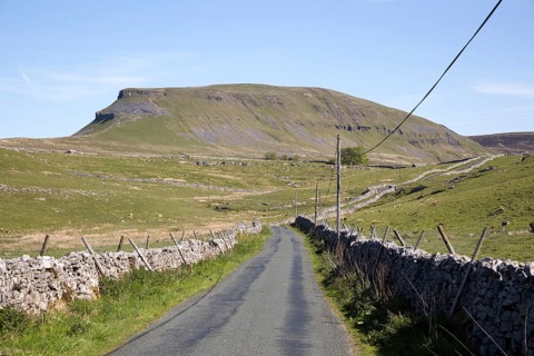 Road and dry stonewalls, Pen Y Ghent, Yorkshire Dales national park, England, UK