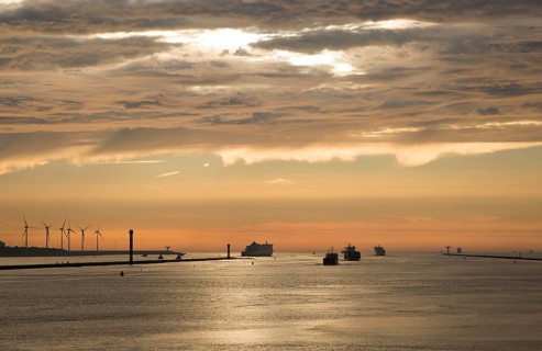 Sunset orange glow landscape clouds water, North Sea shipping, Port of Rotterdam, Hook of Holland,