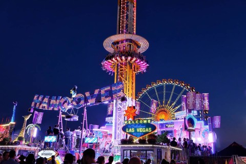 Oktoberfest, evening, illuminated fairground ride HANGOVER, Munich, Bavaria, Germany, Europe