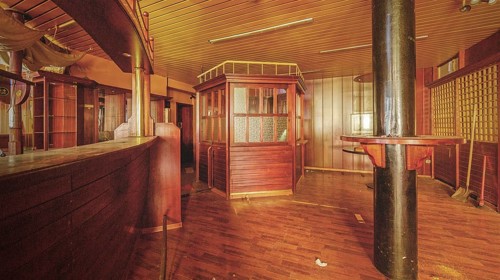 Abandoned bar with wooden counter and interior design that conveys a nostalgic atmosphere, Bad am
