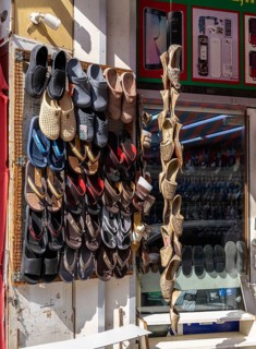 Shoe shops and craftsmen in the Al Fahidi neighbourhood, Dubai, United Arab Emirates, Asia