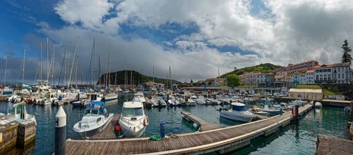 Lively harbour of Horta with many boats and surrounding mountains, Horta, Faial Island, Azores,